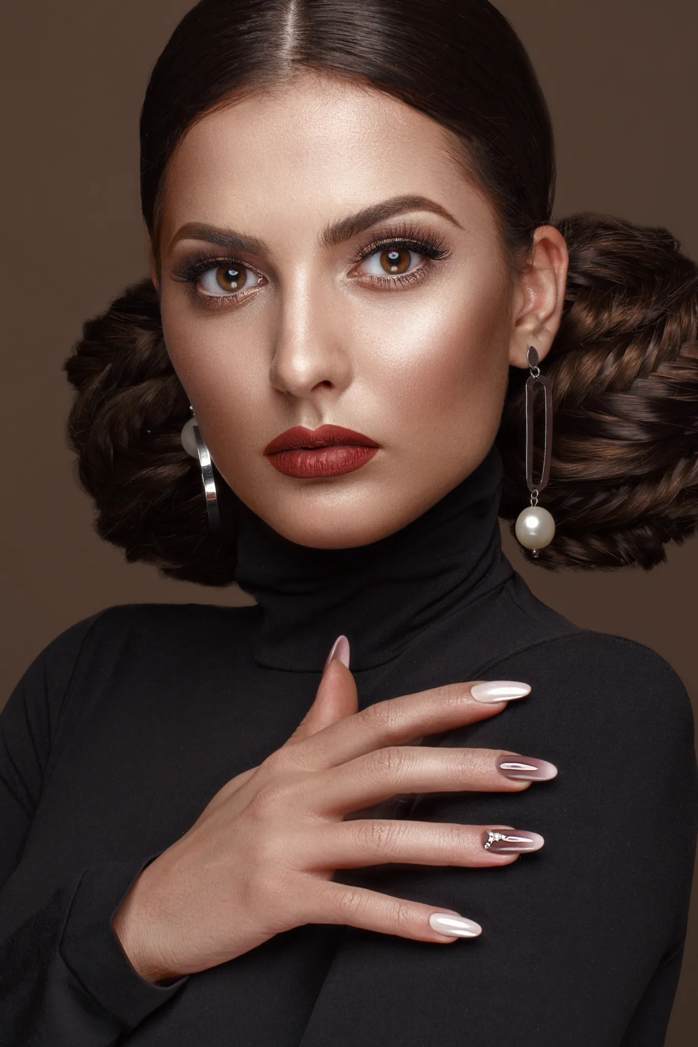 the artist: an elegant woman with braided hair, red lips and burgundy nails