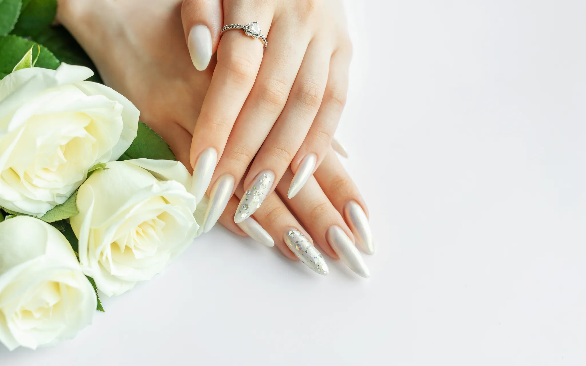 long silver manicure and a ring